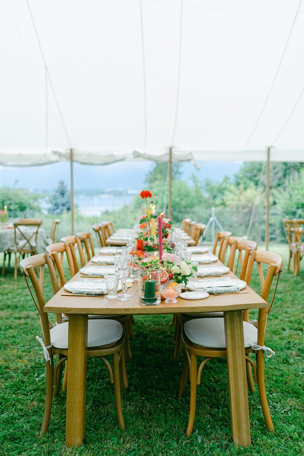 Laid table in the tent with a view over Lake Geneva